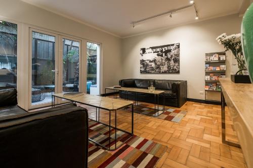 a living room with a couch and a table at Apart Hotel B in Santiago