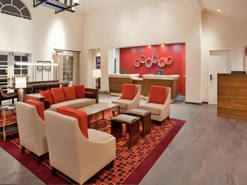 a large living room with couches and chairs at Hotel San Diego-Rancho Bernardo in San Diego