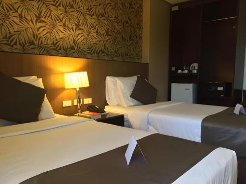 Кровать или кровати в номере GT Hotel Bacolod