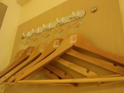 a staircase with a rack with glasses on it at 7 Days Inn Chengdu North Railway Metro Station in Chengdu