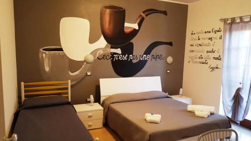 a bedroom with two beds and a sign that reads can trust humanshate at La Dimora Degli Artisti in Catanzaro