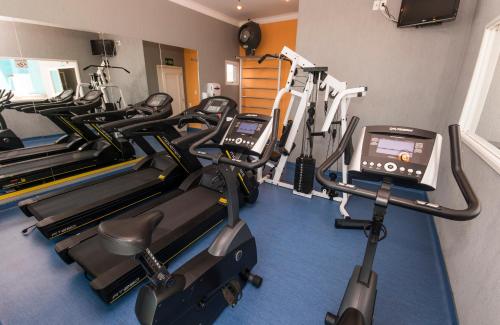 a gym with several tread machines in a room at Transamerica Executive Perdizes in Sao Paulo