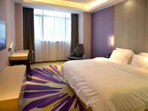 Letto o letti in una camera di Lavande Hotel·Yichun Wanda, High Speed Railway Station
