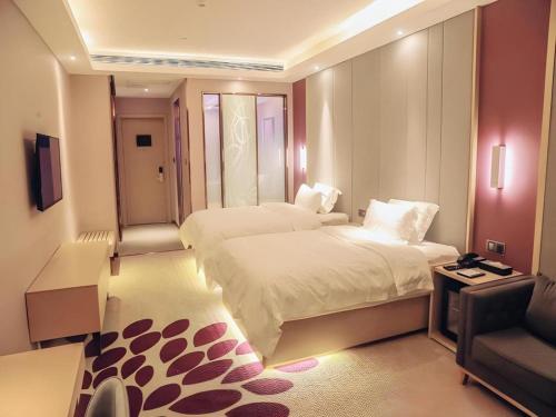 Letto o letti in una camera di Lavande Hotel·Yichun Wanda, High Speed Railway Station