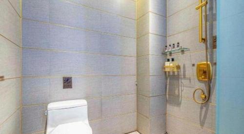 a bathroom with a toilet and a shower at James Joyce Coffetel·Anyang Text Museum in Anyang
