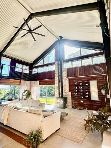 a living room with a couch and a fireplace at Linden Rose Barn in Montville
