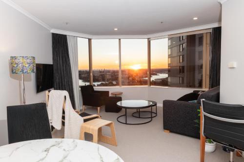 a living room with a view of a city at Spectacular Suite, Bridge & Water views, The Rocks in Sydney
