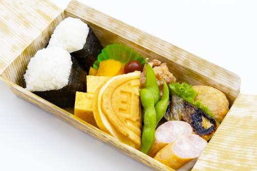a tray of food with sushi and other foods at Lodge Toranoyu in Kokonoe