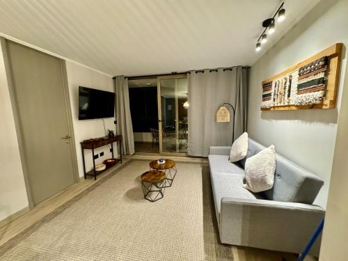 Apartment in Pucón, overlooking the volcanoにあるシーティングエリア
