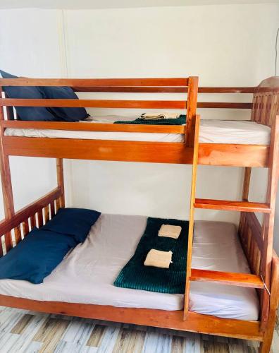 a couple of bunk beds in a room at Cockatoo Room Rentals Siquijor in Siquijor