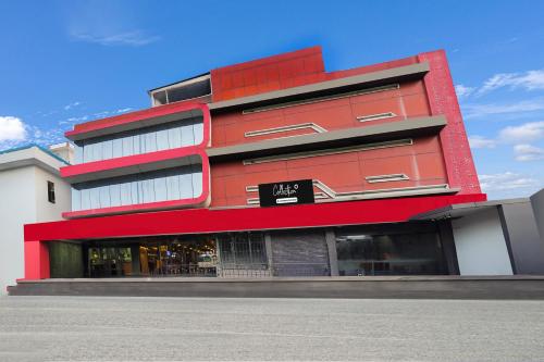 a red building with a sign in front of it at Super Collection O West Vinod Nagar Metro Station Formerly Royal Inn in New Delhi