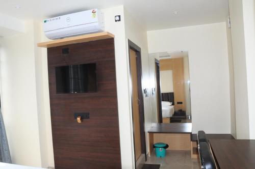 a room with a door with a air conditioner on top at Fern Inn Hotel in Kolkata