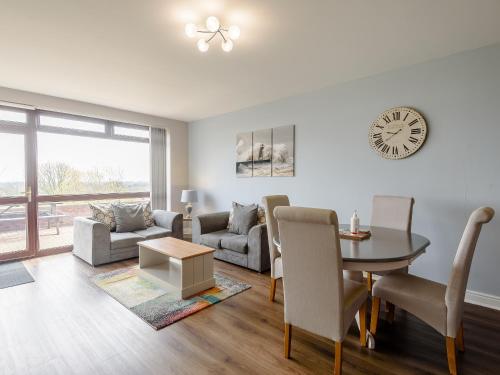a living room with a table and a dining room at Cottage 6 - Uk38217 in Ashby cum Fenby