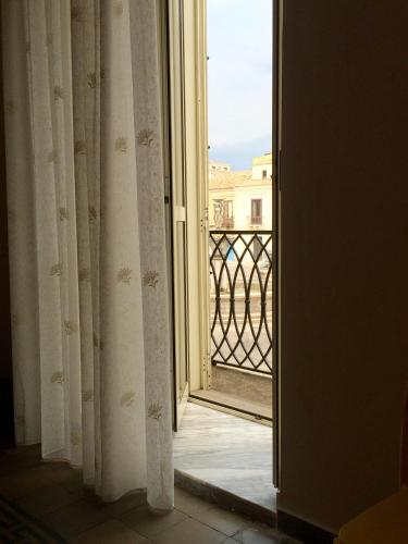 an open door with a view of a balcony at B&B Zia Iaia in Siderno Marina