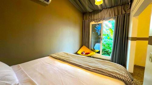 En eller flere senge i et værelse på Sonho do Moreno