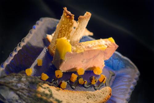 a piece of cake with different types of food on it at Hotel Convento Aracena & SPA in Aracena