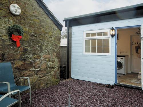 a garage door with a red bow next to a building at Foxes Reach - Hw7421 in Trelleck
