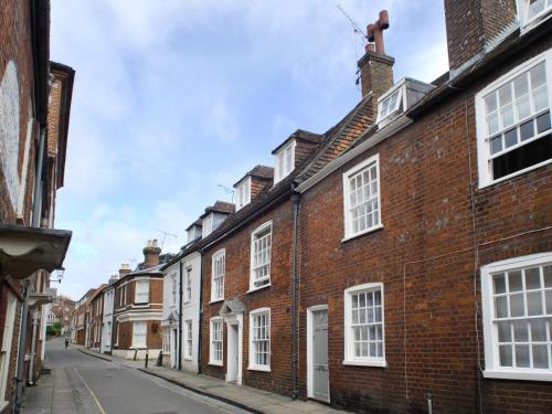 a row of brick houses on a street at Pemberly in Winchester