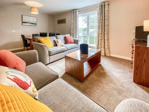 a living room with a couch and a table at Broad Apartment 5 - Uk48081 in Kirkwall