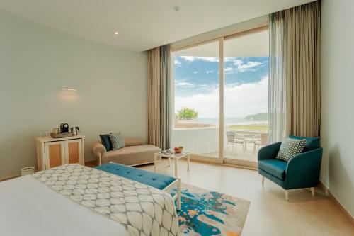 Postel nebo postele na pokoji v ubytování Araqila Boutique Beach Resort near MOPA airport