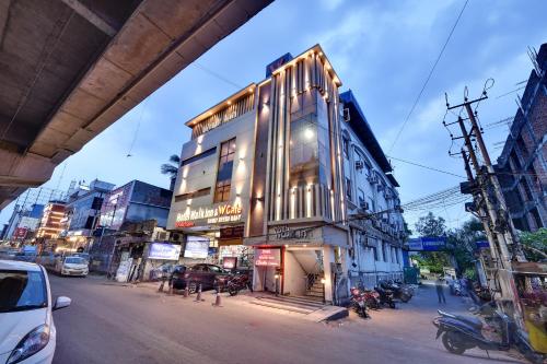 a building on the side of a city street at RnB Select Walk Inn Lucknow in Lucknow