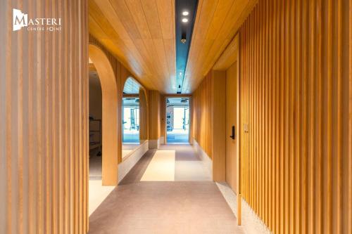 a hallway of an office building with wooden walls and ceilings at Masteri Centre Point, TP HCM in Gò Công