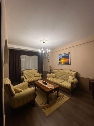 a living room with two couches and a table at Apartment Sanda 72 in Gevgelija