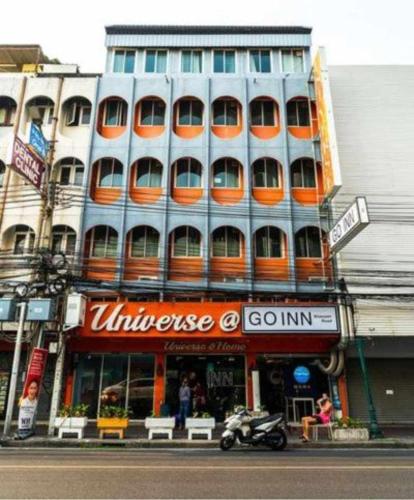 a large building with an orange and white at GO INN Khaosan - โกอินน์ ถนนข้าวสาร in Bang Bua Thong Railway Station