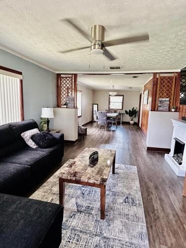 a living room with a couch and a table at Spacious Lake Retreat for Families in Saint Cloud