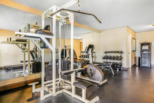 a gym with treadmills and machines in a room at Baymont by Wyndham Cortez in Cortez