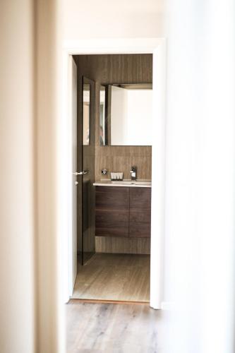 a bathroom with a sink and a mirror at Hotel Platinium Dhermi in Vlorë