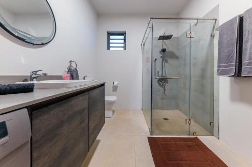 a bathroom with a shower and a sink at Ecostay Apartment in Midlands Station