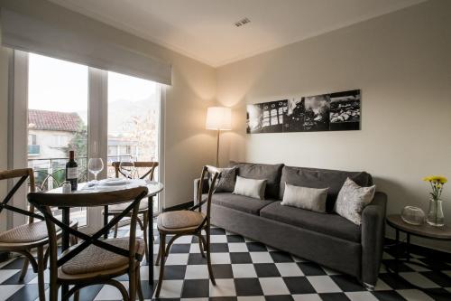 a living room with a couch and a table at Apart Hotel B in Santiago
