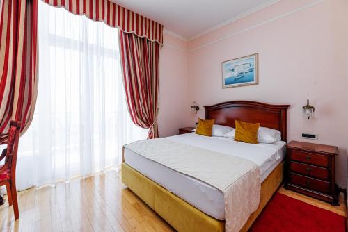 Cama o camas de una habitación en Hotel Savoy