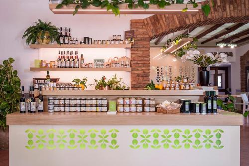 a store with a counter with bottles of wine at Azienda Agrituristica Bergi in Castelbuono