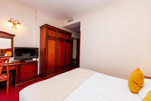 Cama o camas de una habitación en Hotel Savoy