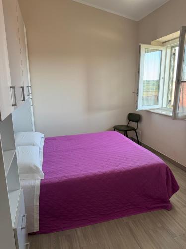 Postel nebo postele na pokoji v ubytování Casa vacanze La Fenice