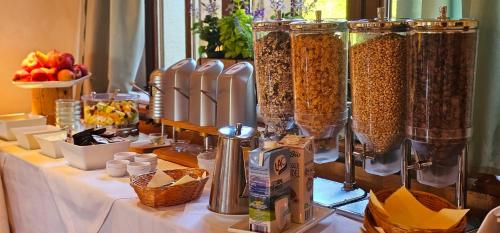 a table topped with lots of food and cereal at Schwaben Resort Ebnisee in Ebni