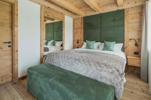 Кровать или кровати в номере Chalet Socrepes - Dolomiti Skyline