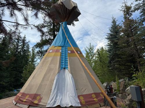 a teepee tent is set up on a table at North Haven Campground in Bonners Ferry