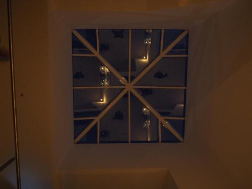 a mirror on a wall with lights in it at Solar de Mos in Lagos
