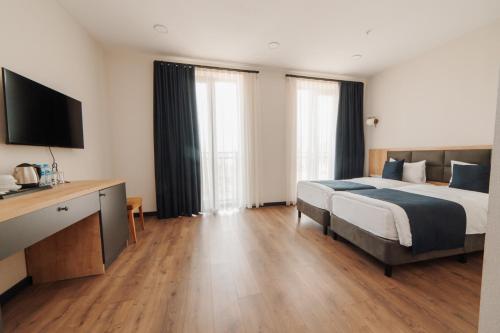 Voodi või voodid majutusasutuse Akhaltsikhe Inn toas