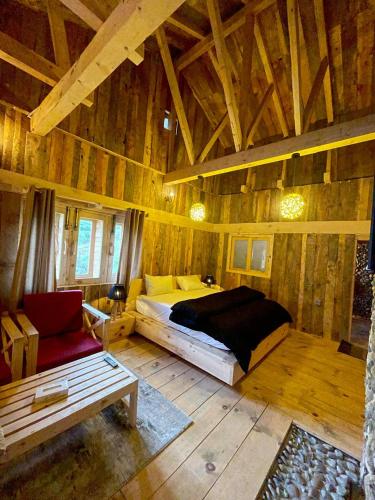 a bedroom with a bed and a couch in a room at The Adventurers Resort in Dhechiān di Bahlk