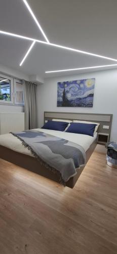 a bedroom with a large bed in a room at Studio Suha living in Škofja Loka