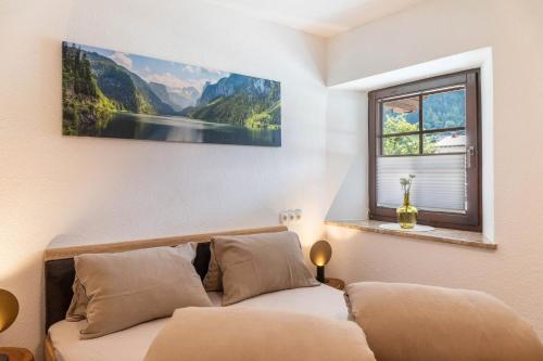 a bedroom with a bed with a picture on the wall at Apart Celina in Oetz