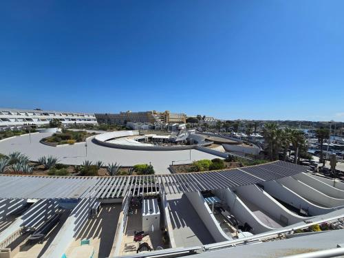 an overhead view of a building with solar panels on it at 2Cap d'Agde NATURISTE Grand T2 de standing avec GARAGE privé in Cap d'Agde