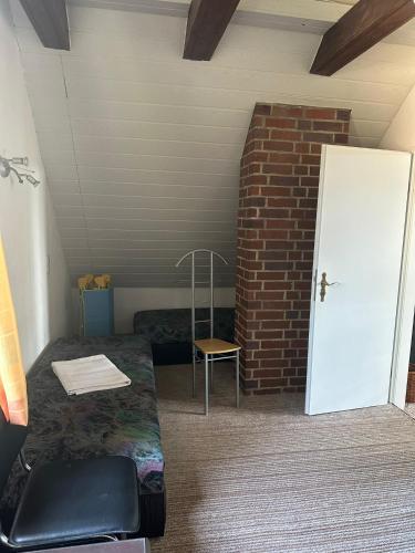 a room with a door and a brick wall at Ferienhaus Gisela in Fürstenberg-Havel