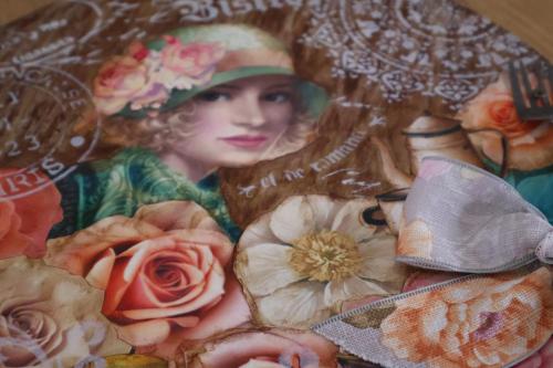 a painting of a woman with a hat and flowers at Aalkie's Dream in Swellendam
