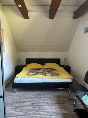 a bedroom with a large bed in a attic at Ferienhaus Gisela in Fürstenberg-Havel