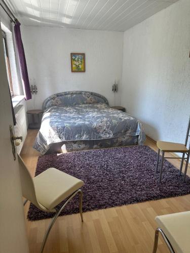 a bedroom with a bed and a rug at Ferienhaus Gisela in Fürstenberg-Havel